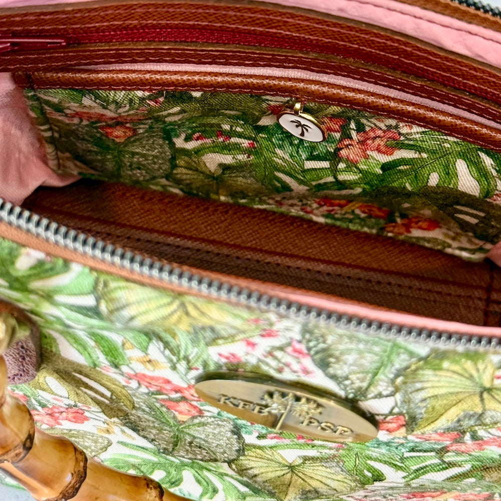 Close-up of a floral-patterned bag with a visible brand logo.